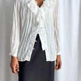 White pleated blouse
