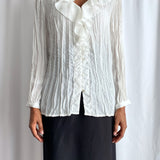 White pleated blouse